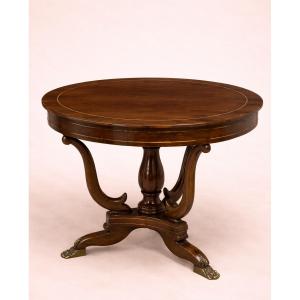 Table ronde Empire – acajou avec incrustations et pieds griffes 