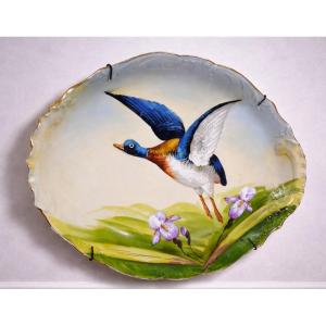 Plat décoratif ancien en porcelaine – décor canard en vol  