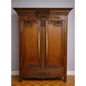 A Richly Carved, Solid Oak Norman Wedding Armoire From The Louis XV Period. 