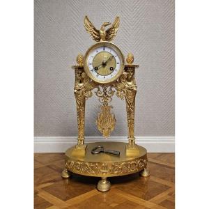 A Finely Chased And Gilded Bronze Portico Clock, Empire Period, Circa 1800