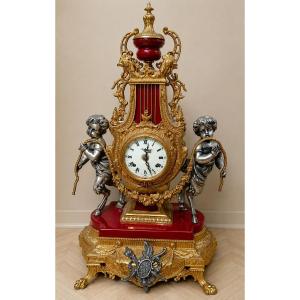 Pendule lyre aux angelots en bronze et régule patiné et doré