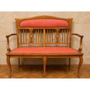 Banquette époque Art Nouveau en bois fruitier marqueté  