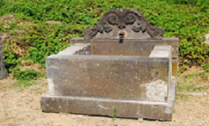 Ancient Fountain In Volcanic Black Stone