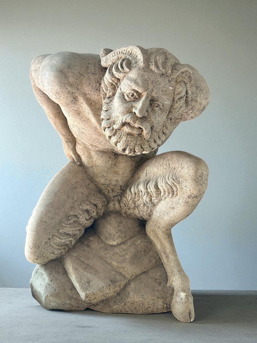 Sculpture Depicting A Kneeling Man -photo-1