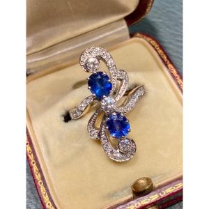 18k Gold Sapphire And Diamond Ring With Scroll Decor