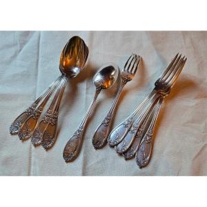 Suite de 10 couverts en argent massif, modèle Louis XVI au laurier et monogrammé, Hénin & Cie, 