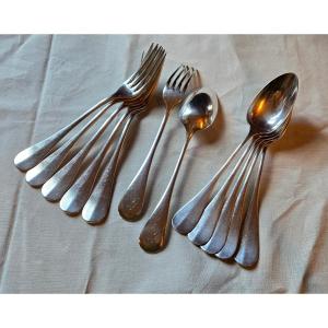 Suite de 12 couverts en argent massif, modèle uni-plat, Hénin & Cie, 973 g 