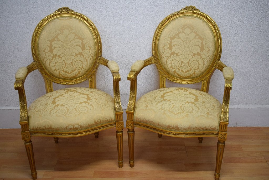 Pair Of Louis XVI Cabriolet Armchairs In Golden Wood