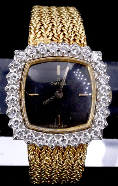 Montre 2 ors Omega diamants années 60