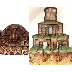 Suite de Six chaises cannées,  à la grenade. Epoque Régence