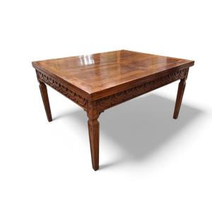 Grande table pliante en noyer sculpté