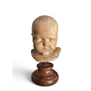 Tête d'enfant en terre cuite