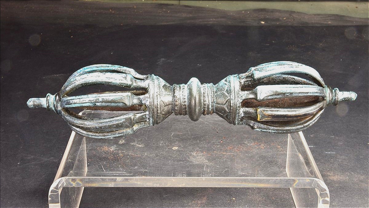 Tibet, Late 19th Century, Oblong 9-pointed Bronze Vajra.