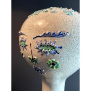 France, Milieu Du XXème Siècle, marotte en faïence émaillée au décor de fleurs.