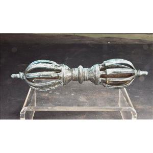 Tibet, Late 19th Century, Oblong 9-pointed Bronze Vajra.