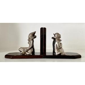 France, 1930s, Pair Of Pierrot And Colombine Silver Spelter Bookends On Wooden Pedestals.