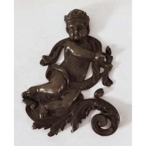 Crowned Putto In Bronze.