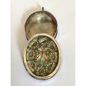 Small Silver Pendant Reliquary With Scrolls. 8 Relics
