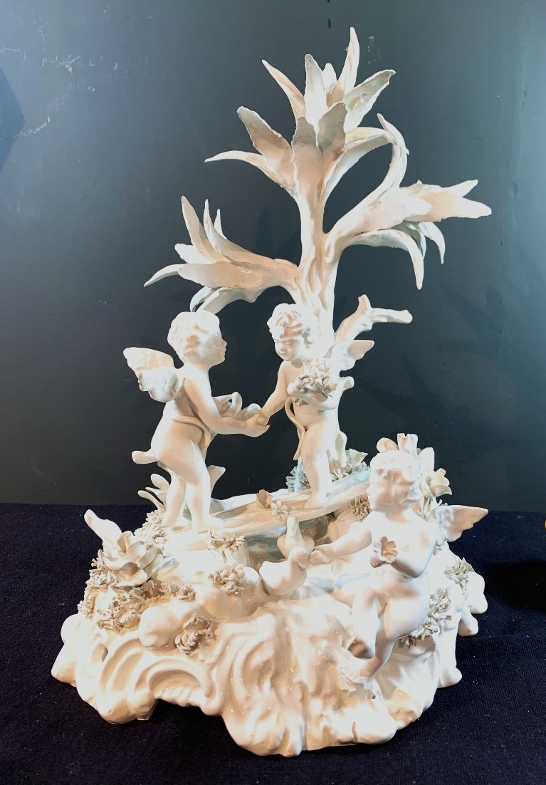 Group Of Three Cupids Playing By A River. White Earthenware. Italy, Early 19th Century.