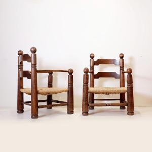 Paire de fauteuils Charles Dudouyt « Ladder Back » en chêne avec assise en jonc, France, 40s