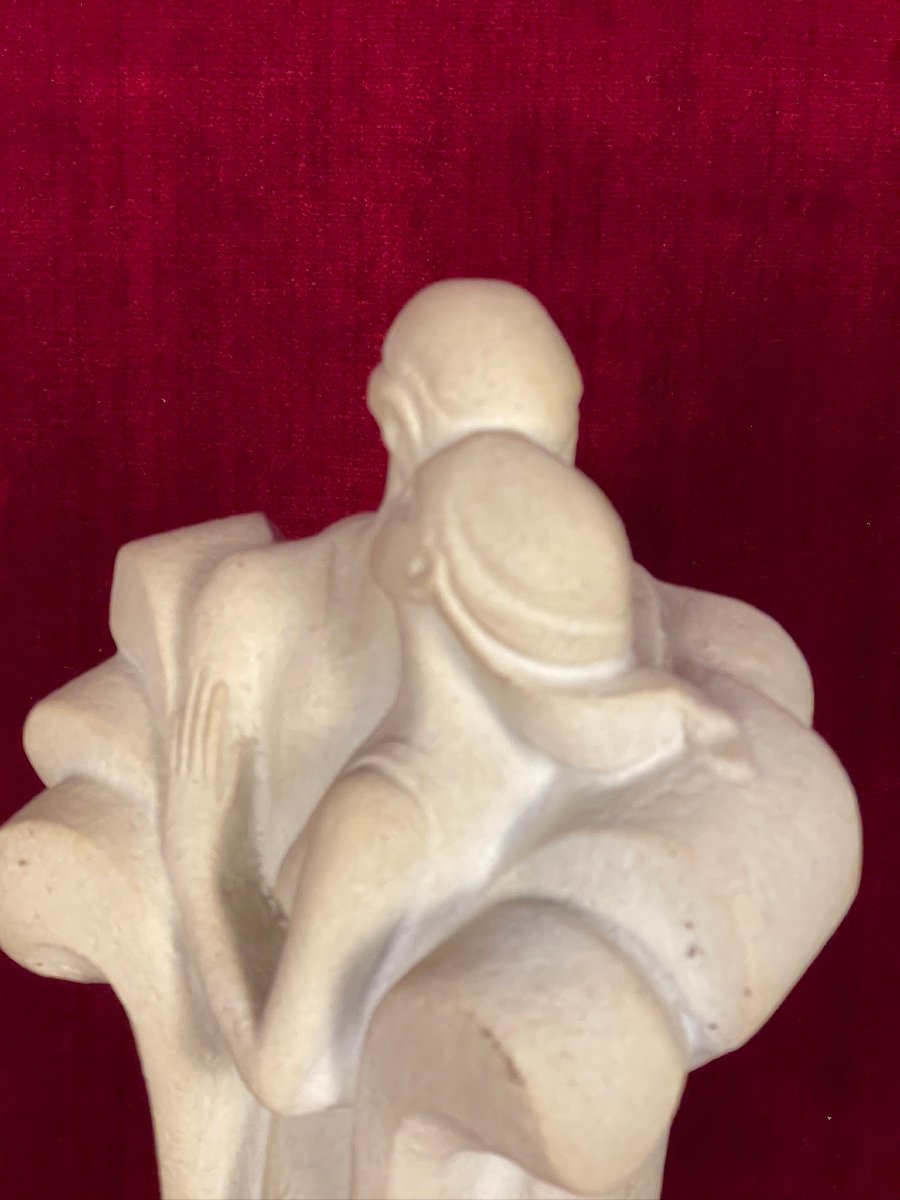 Couple Embracing In A Long Coat, Art Deco Style Stone-photo-1