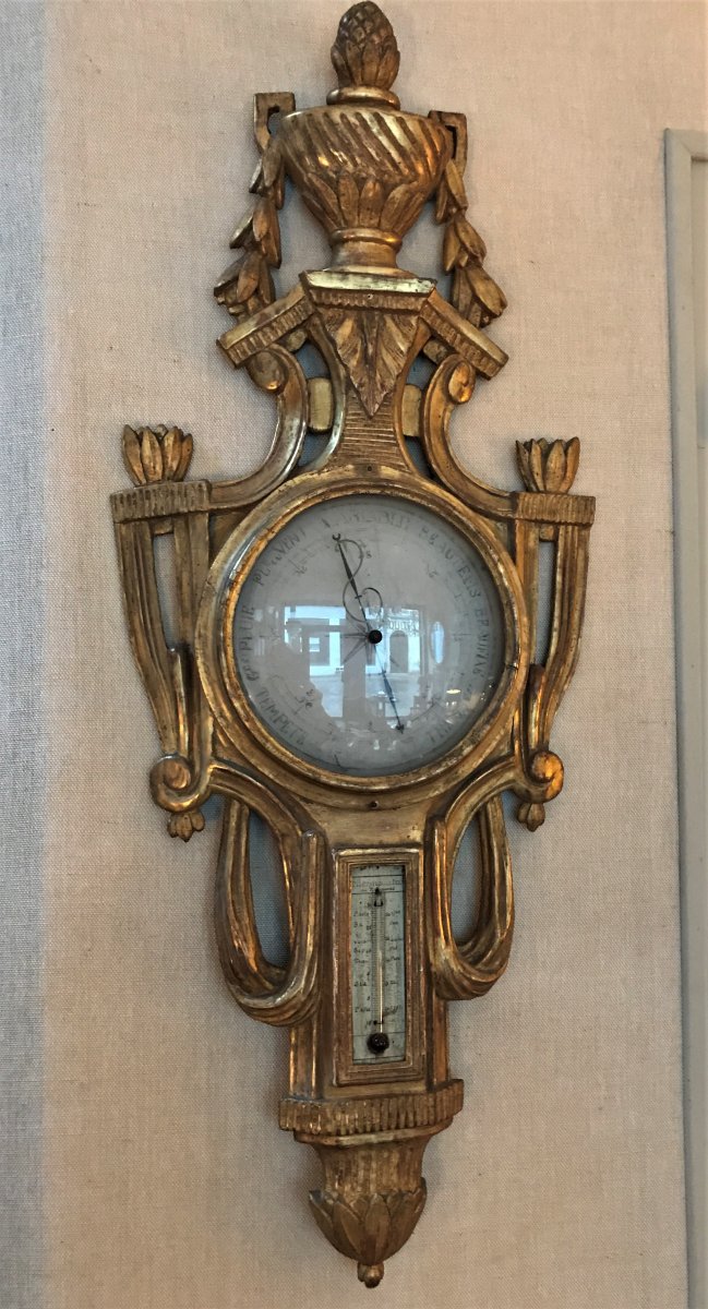 Baromètre - thermomètre en bois sculpté et doré d'époque Louis XVI