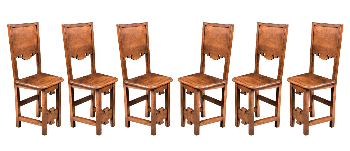 Six Solid Walnut Refectory Chairs. Friuli, 17th Century.