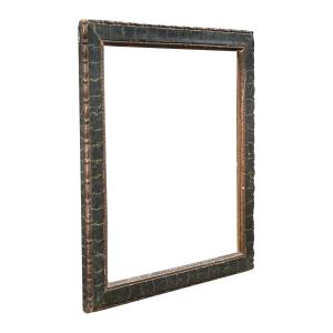 Cadre en bois sculpté, laqué et peint, à l'aspect marbré. Italie, XVIIIe siècle.
