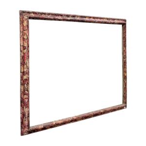Cadre en bois sculpté, laqué et peint, à l'aspect marbré. Italie, XVIIIe siècle.