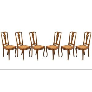 Six chaises en noyer sculpté et ajouré. Venise, fin du XIXe siècle.