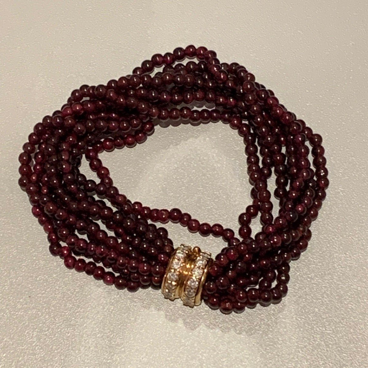 2799- Bracelet 8 Rows Garnet Balls Diamond Clasp