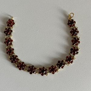 4742- Yellow Gold Garnet Articulated Bracelet