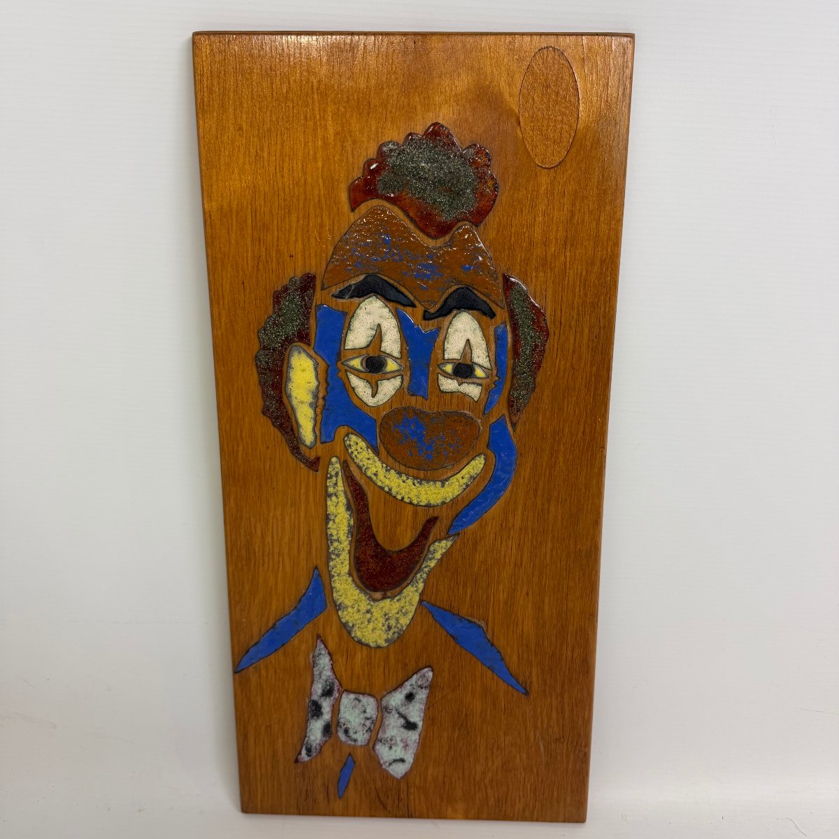 Décoration murale en céramique représentant un clown 