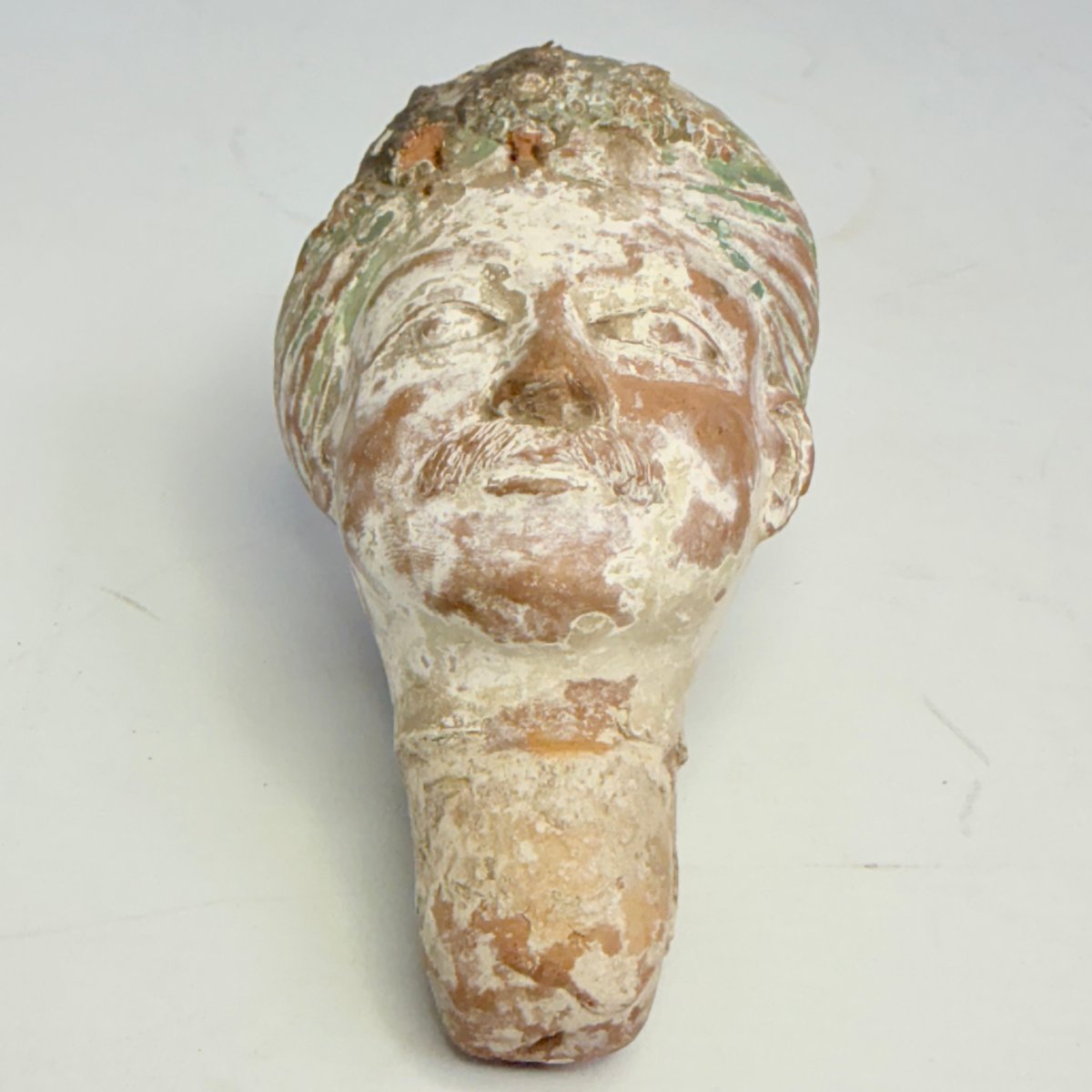 Ancient Sculpture Depicting A Terracotta Head -photo-4