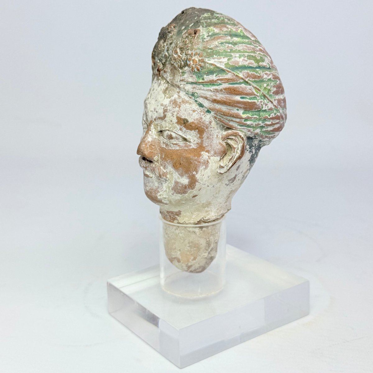 Ancient Sculpture Depicting A Terracotta Head 