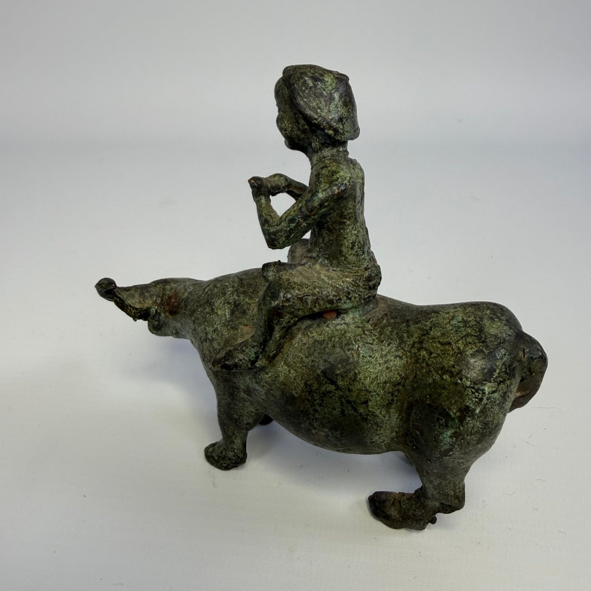 Ancient Chinese Bronze Sculpture Depicting A Shepherd Riding A Water Buffalo -photo-1