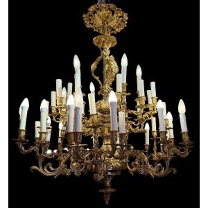 Gilded Bronze Chandelier With 42 Light Arms Arranged In Two Rows, Featuring A Regency-style Acanthus Leaf Motif 