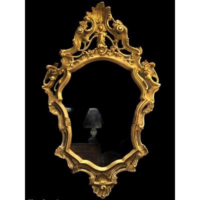 Miroir en bois sculpté doré de style Louis XV 19è siècle