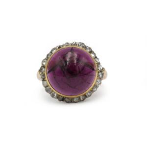 Bague en or jaune 750, diamants tailles anciennes et grenat cabochon