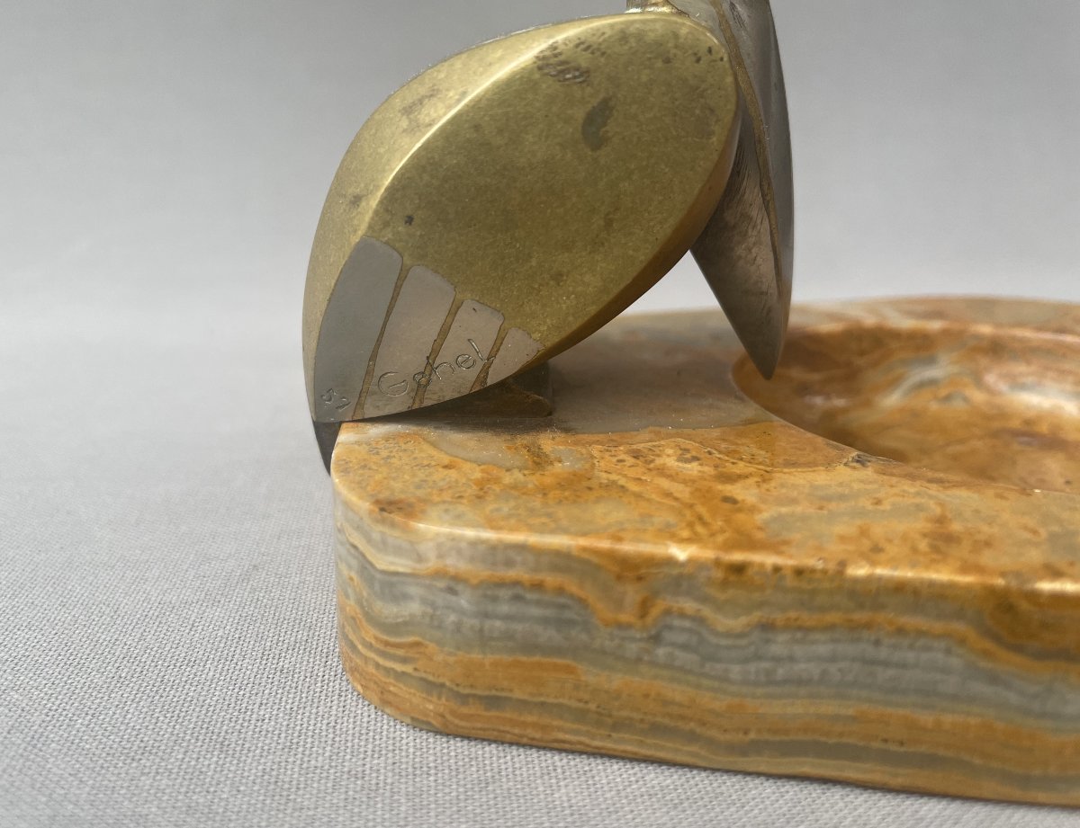 Empty Pocket Topped With A Bronze Pelican-photo-2
