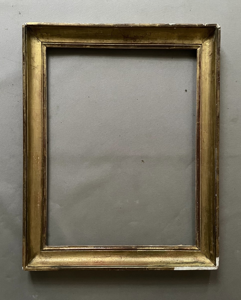 Cadre en bois et stuc doré