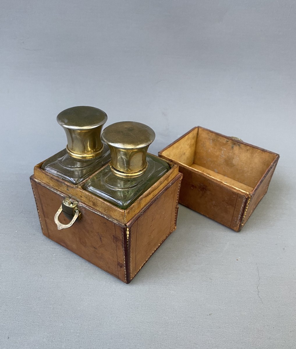 Two Bottles Of Perfume And Their Travel Case-photo-2