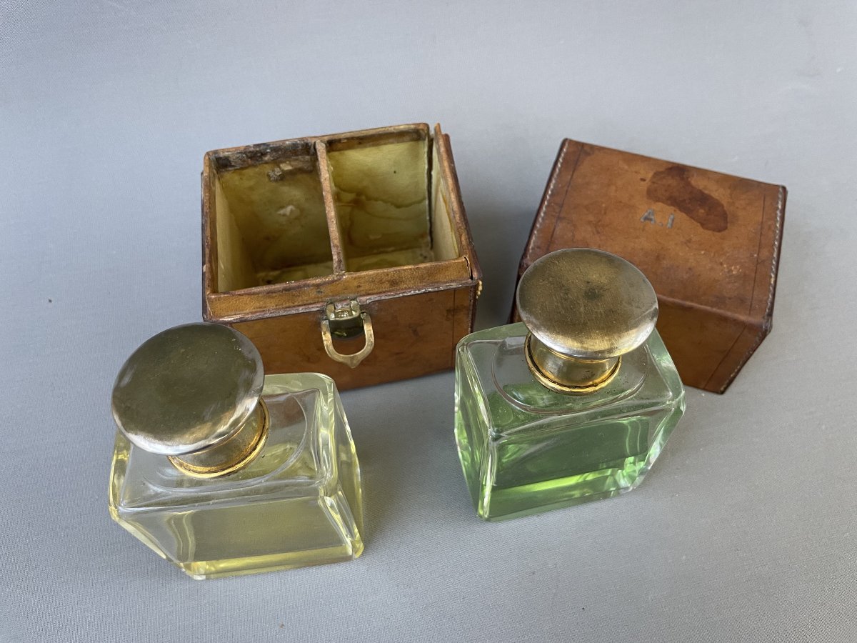 Two Bottles Of Perfume And Their Travel Case-photo-4