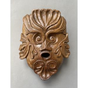 Gros mascaron en bois sculpté