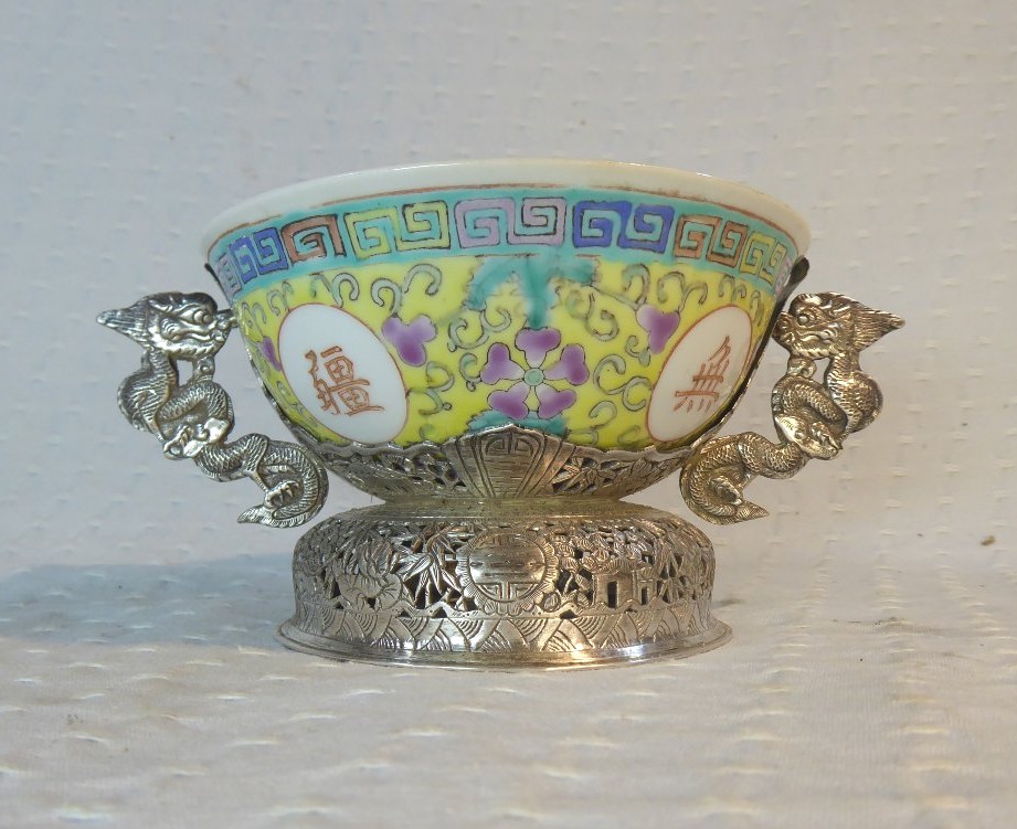 A Chinese Porcelain Bowl With A Yellow Bottom, Known As An “anniversary” Bowl, On A Silver Stand Decorated With