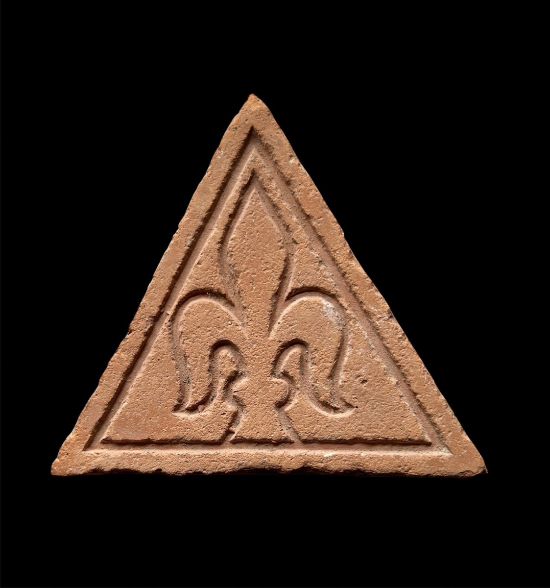 A German Floortile With Fleur-de-lis Decoration