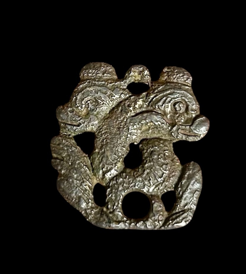 A Pendant With Marine Creatures Resembling Dolphins, 16th Century Or Earlier