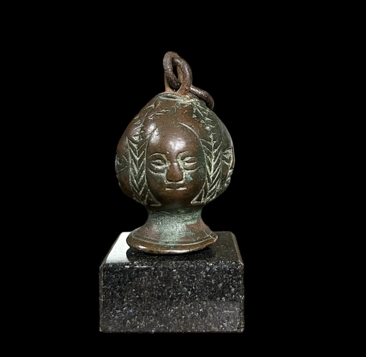 A 15th-century Sword Pommel With 4 Women's Faces