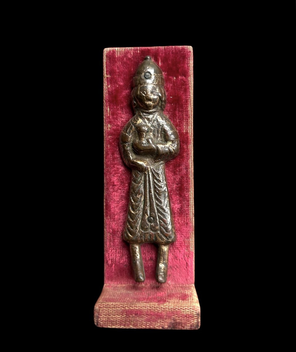 An Embossed And Gilded Copper Figure Holding A Cup, Iran-12th Century