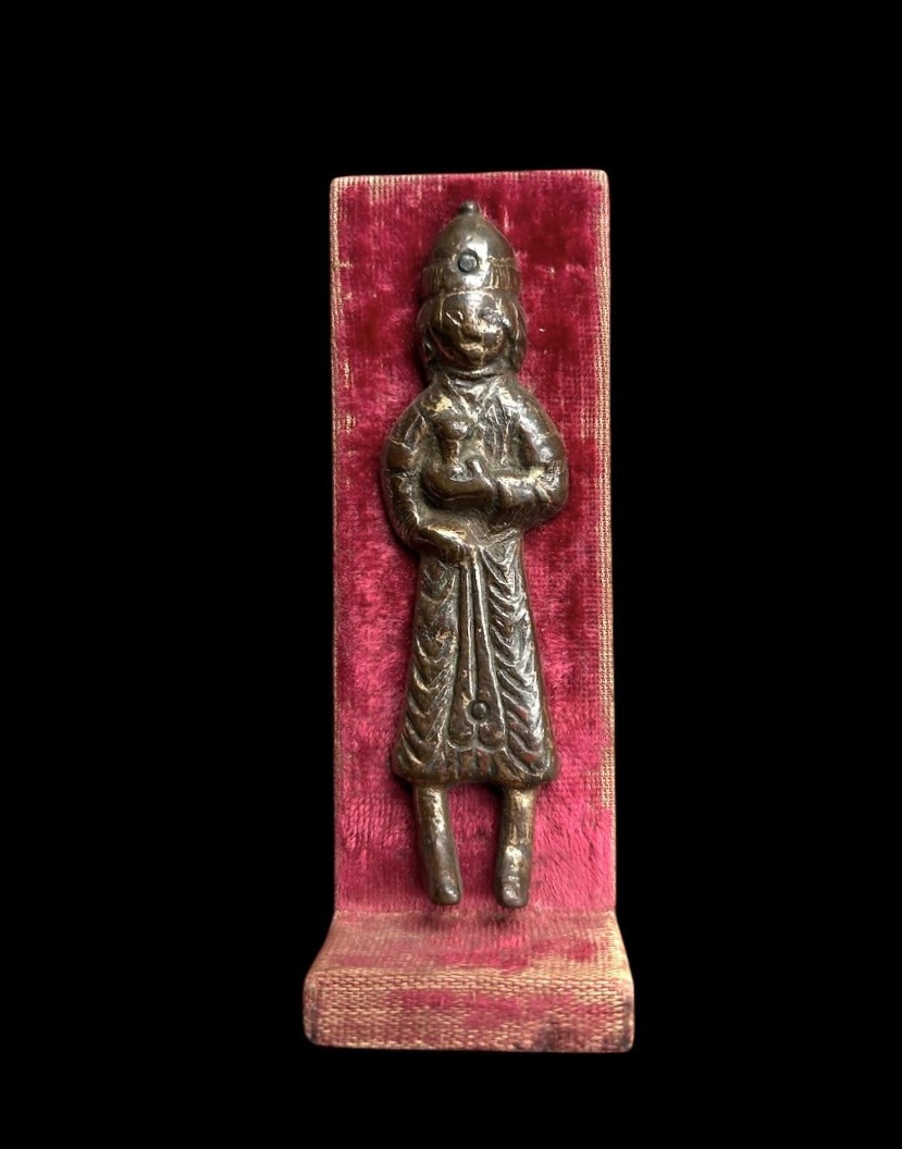 An Embossed And Gilded Copper Figure Holding A Cup, Iran-12th Century